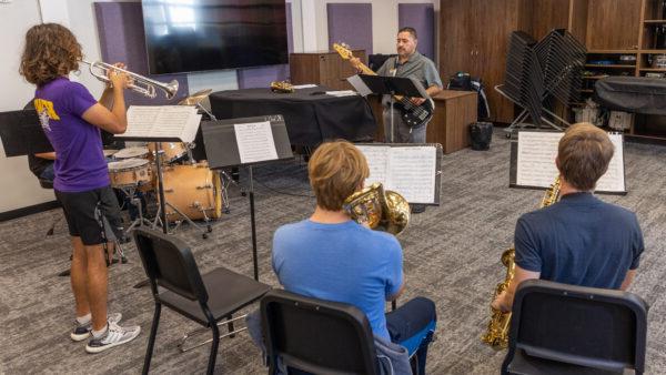 Music instructor with group of students